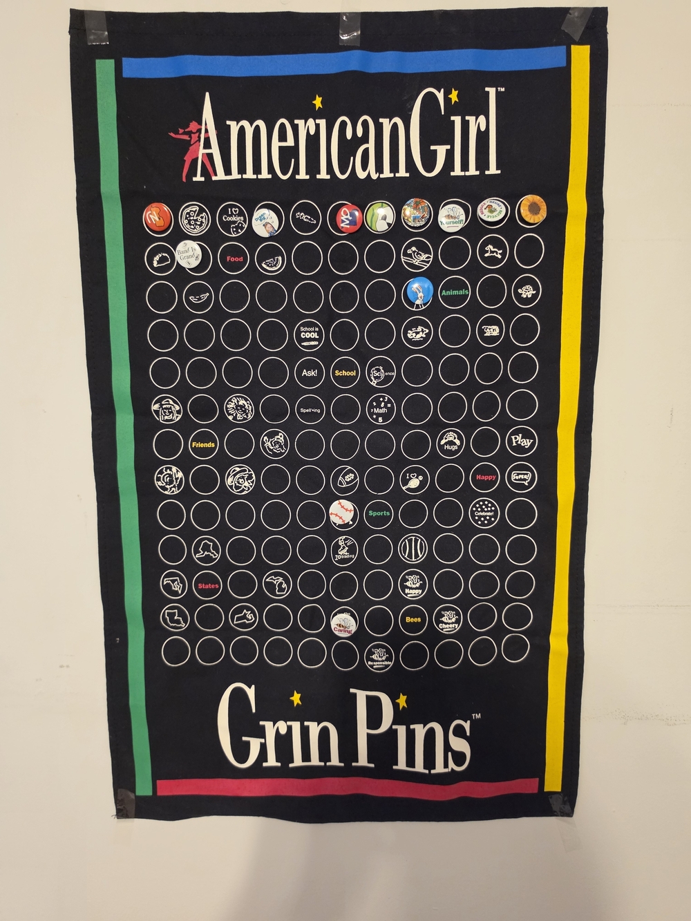 American Girl Black Grin Pins Display Banner with Green, Blue, Yellow Accents